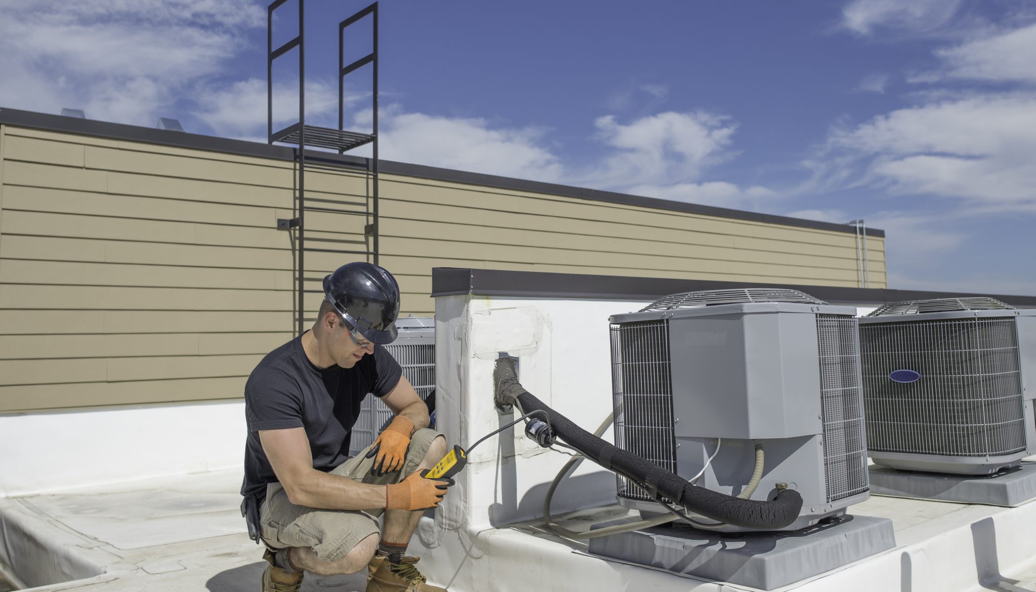 Performing a leak test on an outside condensing unit refrigerant line.